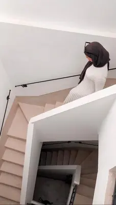 a person sitting on top of a stair case at Penthouse city center asdfghjsasdfghjk in Marrakech