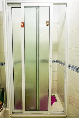 a shower with glass doors in a bathroom at apartment in Hay mabrouka gueliz Marrakech in Marrakech