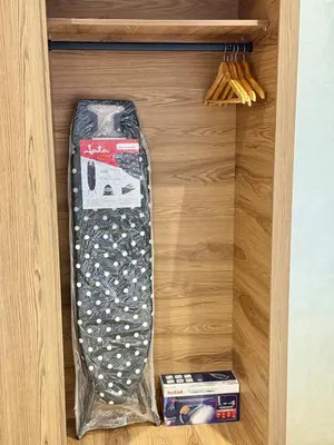 a drawer with a tie in a wooden cabinet at Stylish and cozy accommodation for families in Marrakech