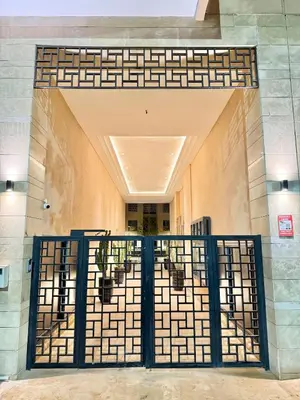 an entrance to a building with a gate at Stylish and cozy accommodation for families in Marrakech