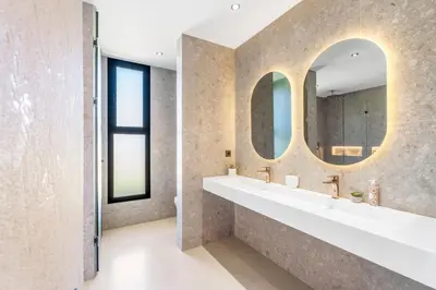 a bathroom with two sinks and two mirrors at VILLA Twenty six 1600m2 Marrakech LUXE & PROXIMITÉ in Marrakech