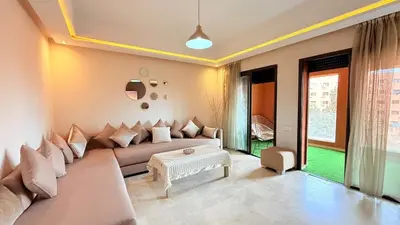 a living room with a couch and a table at Chic Stay in Gueliz 4 Free Parking Netflix in Marrakech