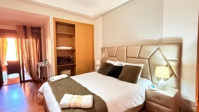 a bedroom with a large bed in a room at Chic Stay in Gueliz 4 Free Parking Netflix in Marrakech