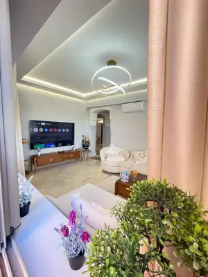 a living room with a couch and a tv at nice apartment, Luxury Wintering, Caprice Palace in Marrakech