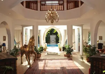 a large lobby with a statue of a horse in the middle at Private villa Marrakech in Marrakech