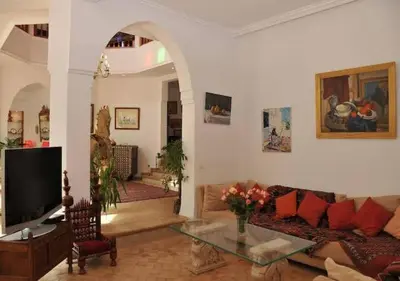 a living room with a couch and a table at Private villa Marrakech in Marrakech
