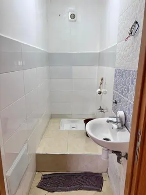 a bathroom with a sink and a bath tub at Apartmen rentals with M Z in Oulad Akkou