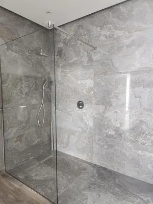 a shower with a glass door in a bathroom at Atlas villa c3 in Sraghna
