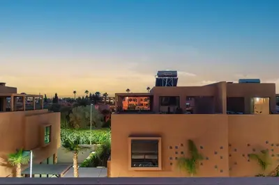 a building with a water tower on top of it at Elegant Villa Free Breakfast Heated Pool Spa in Marrakech