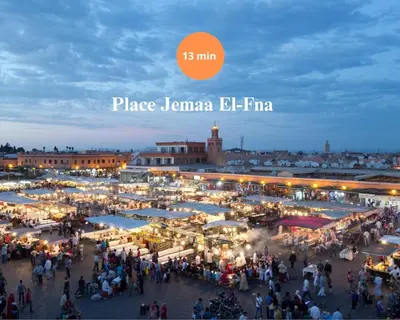 a crowd of people walking around a market at night at The Velvet Retreat - Marrakech in Marrakech