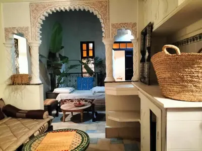 a living room with a couch and a table at Dar tranquille in Marrakech