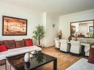 a living room with a couch and a table at Timeless Hideaway in Marrakech