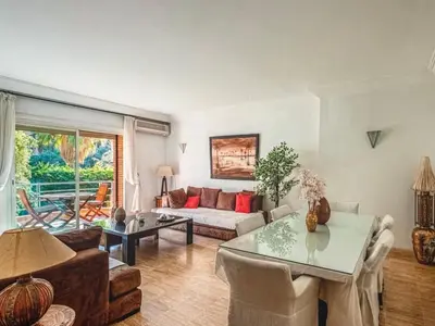 a living room with a couch and a table at Timeless Hideaway in Marrakech