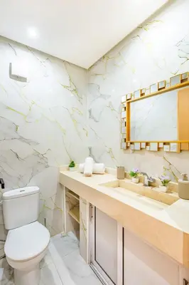 a bathroom with a toilet and a sink at Appartement spacieux 83 m carré Wi Fi Marrakech in Marrakech
