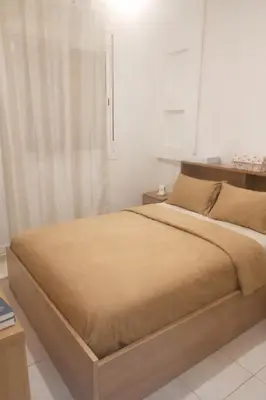 a bedroom with a large bed in a room at appartement pour famille ou femme in Marrakech