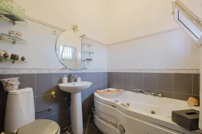 a bathroom with a tub and a sink and a toilet at Riad Palm Oasis Marrakech in Marrakech