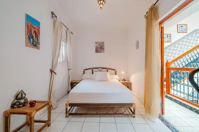 a bedroom with a bed and a window at Riad Palm Oasis Marrakech in Marrakech