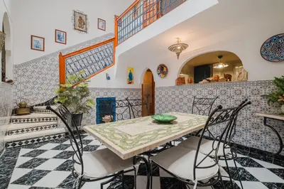 a dining room with a table and chairs at Riad Palm Oasis Marrakech in Marrakech