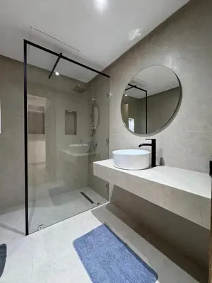 a bathroom with a sink and a mirror and a shower at Villa 60 Saphir in Marrakech