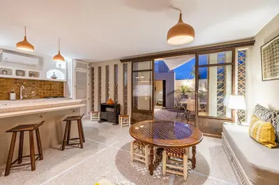 a living room with a couch and a table at Riad Kenous - Exclusive&New -6 pax- Pool & Breakfast in Marrakech
