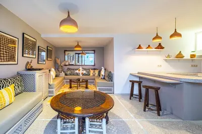 a living room with a couch and a table at Riad Kenous - Exclusive&New -6 pax- Pool & Breakfast in Marrakech