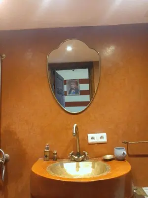 a bathroom with a sink and a mirror on the wall at Riad Green Atlas in Marrakech