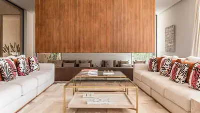 a living room with two couches and a coffee table at Villa Olfa in Oulad Ikhia