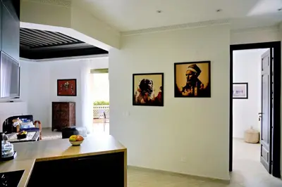 a kitchen with three framed pictures on the wall at Nassim Al Noor in Marrakech