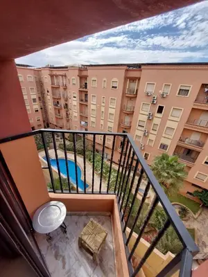 a balcony with a view of a apartment complex at Elegant cocoon in Guéliz with 2 bedrooms in Marrakech
