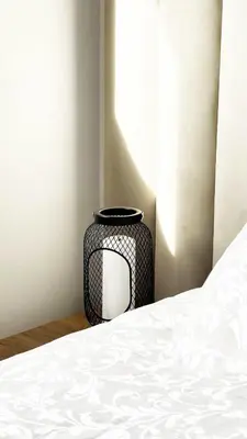 a corner of a room with a bed and a vase at Marrakech Station Apartment in Marrakech