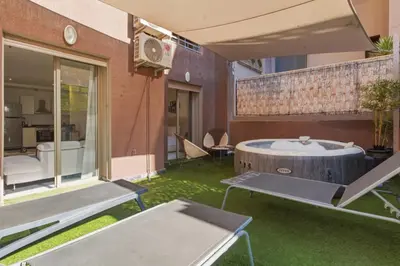 a room with a bath tub in the middle of a yard at T2 - Terrasse et Jacuzzi - Coeur de Guéliz in Marrakech