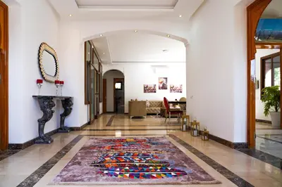 a hallway with a large rug on the floor at فيلال نادية in Marrakech
