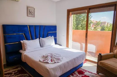 a bedroom with a bed with towels on it at فيلال نادية in Marrakech