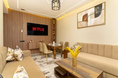 a living room with a couch and a table at Elegant Modern Appartement in Gueliz Luxury Touch in Oulad Akkou