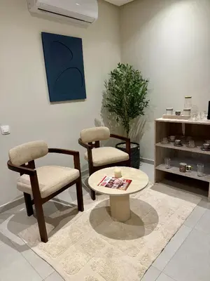 a living room with two chairs and a table at Luxury Town Center Gueliz 2 Chambres Parking Grande Terrasse in Marrakech