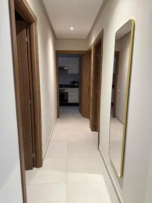 a hallway with two mirrors and a tile floor at Luxury Town Center Gueliz 2 Chambres Parking Grande Terrasse in Marrakech