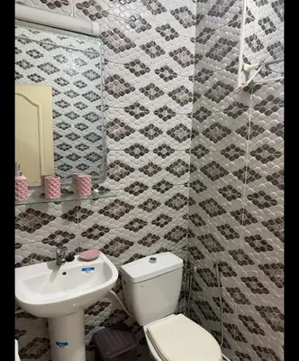 a bathroom with a toilet and a sink at Boston in Marrakech