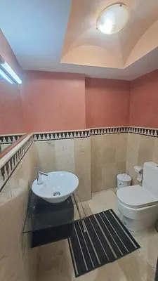 a bathroom with a toilet and a sink at Chez Abdou II in Marrakech