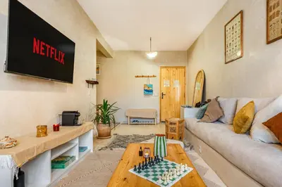 a living room with a couch and a table at Beautiful Moroccan 2BR Close to City Center in Marrakech