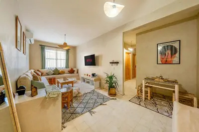 a living room with a couch and a piano at Beautiful Moroccan 2BR Close to City Center in Marrakech