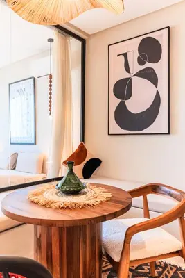 a living room with a table and a couch at Suite Tifawt - Central, Design & Lumineux in Marrakech