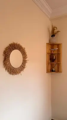 a mirror on a wall next to a shelf at Your Hidden Oasis, Quiet, Cozy and Charming in Marrakech