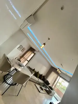 a living room with a blue line on the ceiling at Marrakech Prestigia Center Pool View 3 Bedrooms in Marrakech