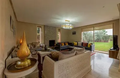 a living room with a couch and a table at Luxury Villa Inspired by Authentic Moroccan Design in Marrakech