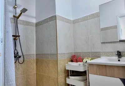 a bathroom with a sink and a shower at Luxury Family Apartment in Gueliz in Marrakech