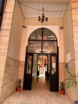 an entrance to a building with two doors at Appartement Nature et design in Marrakech