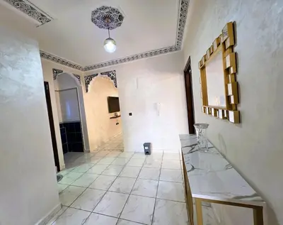 a large room with a tile floor and a hallway at Jonas House in Marrakech