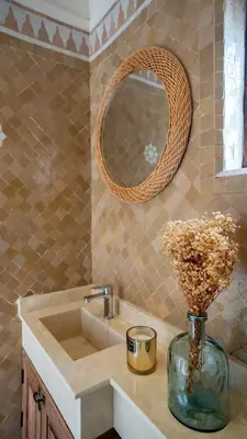 a bathroom with a sink and a vase of flowers at Riad Lala Fatima - New & Exclusive - Pool & Breakfast in Marrakech