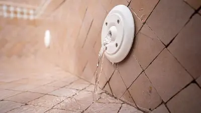 a water outlet on a wall with water pouring out at Riad Lala Fatima - New & Exclusive - Pool & Breakfast in Marrakech