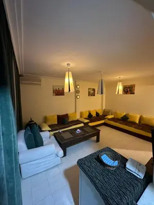 a living room with a couch and a table at مراكش كليز in Marrakech